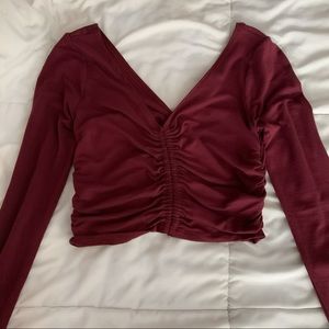 Maroon ruched long sleeve crop top